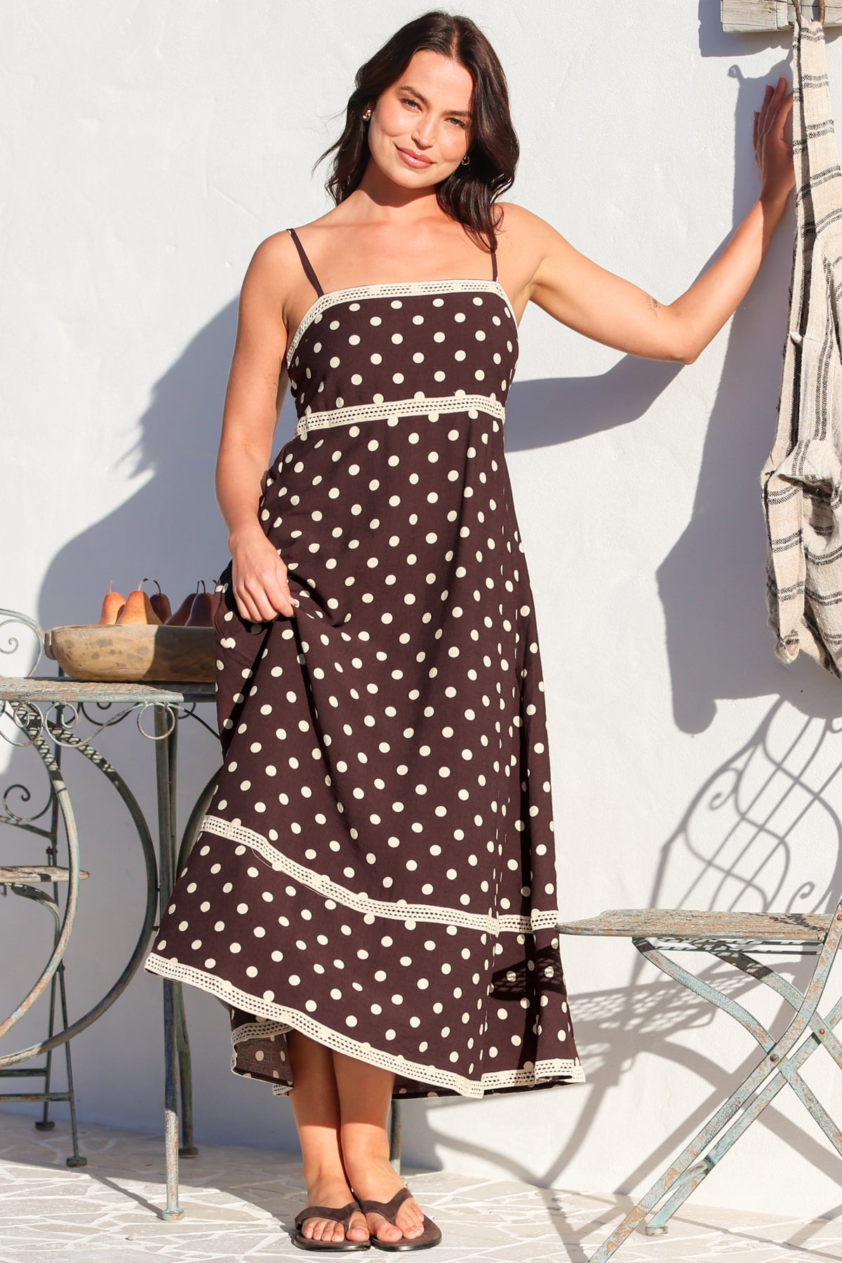 Model wearing Novalie Midi Dress in Polka Chocolate from Salty Crush