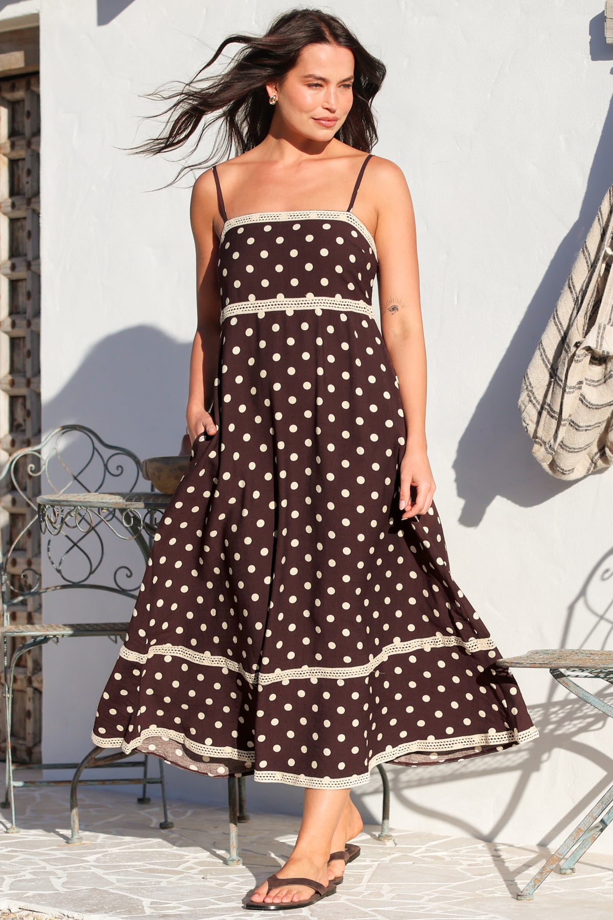 Model wearing Novalie Midi Dress in Polka Chocolate from Salty Crush