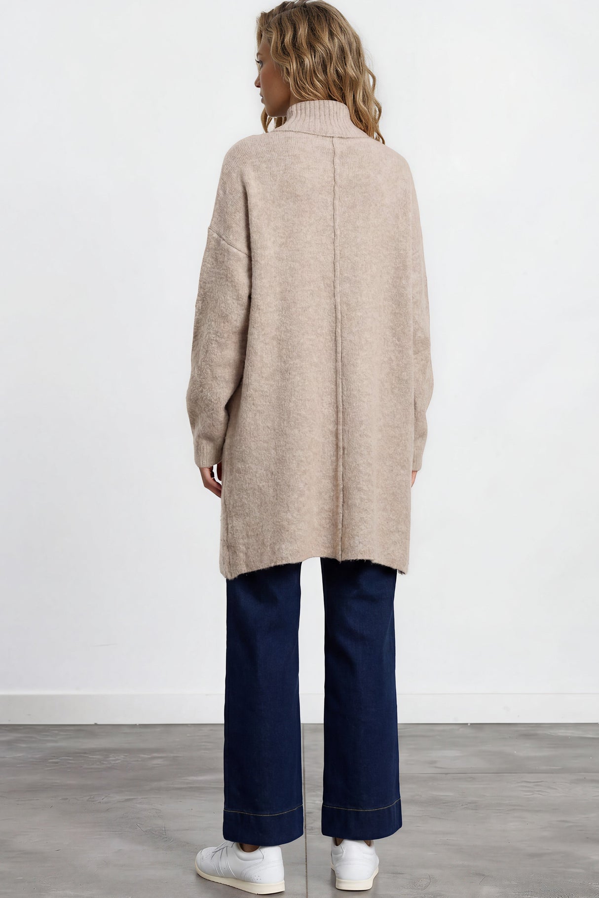 Model wearing Oswin Cardigan in Beige from Salty Crush