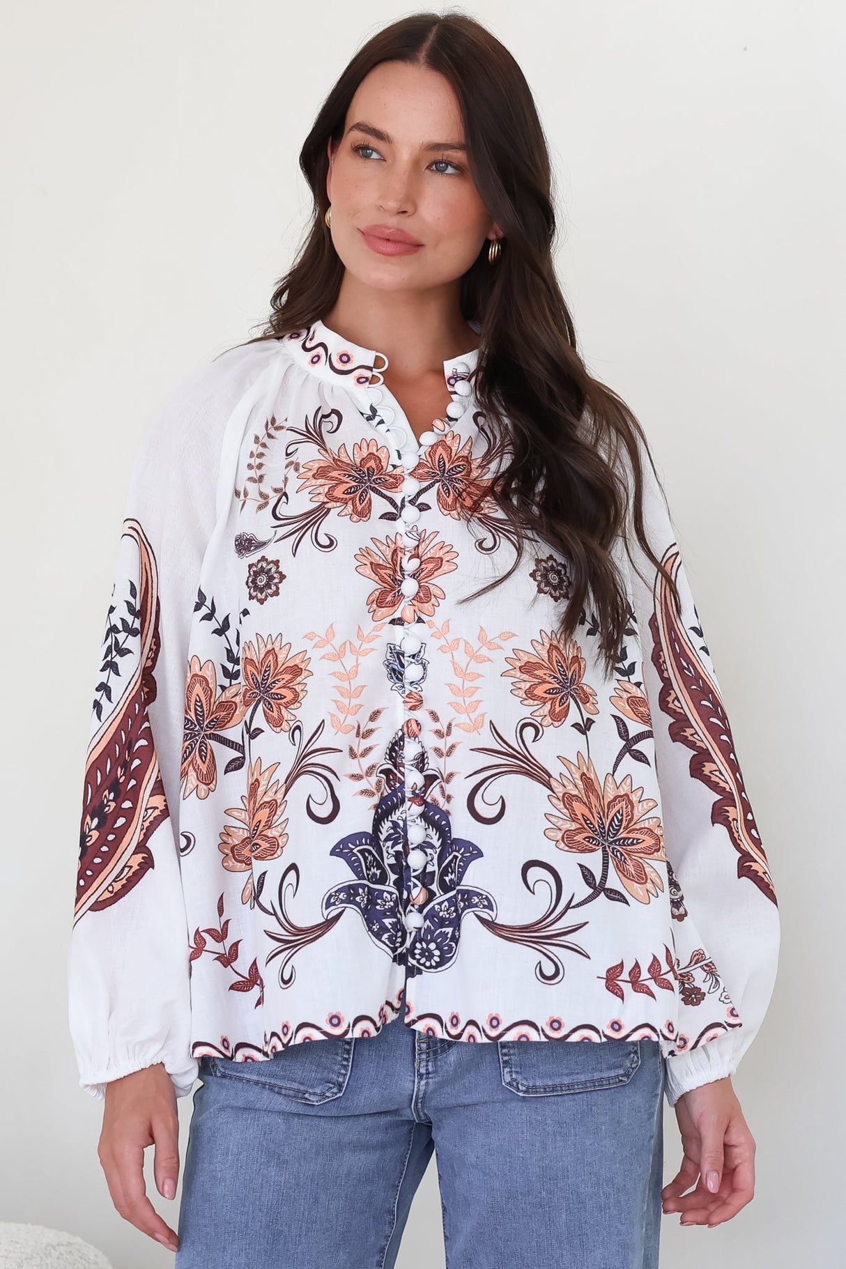 Model wearing Portia Blouse in Magah Print from Salty Crush