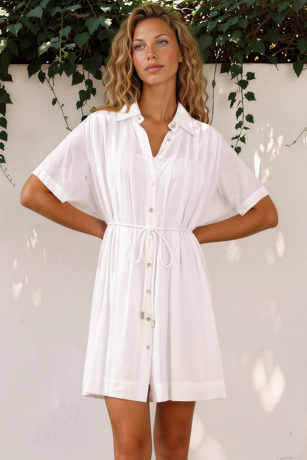 Model wearing Santara Mini Dress in White from Salty Crush