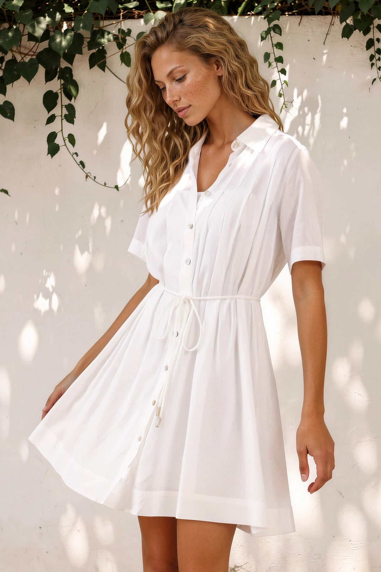 Model wearing Santara Mini Dress in White from Salty Crush