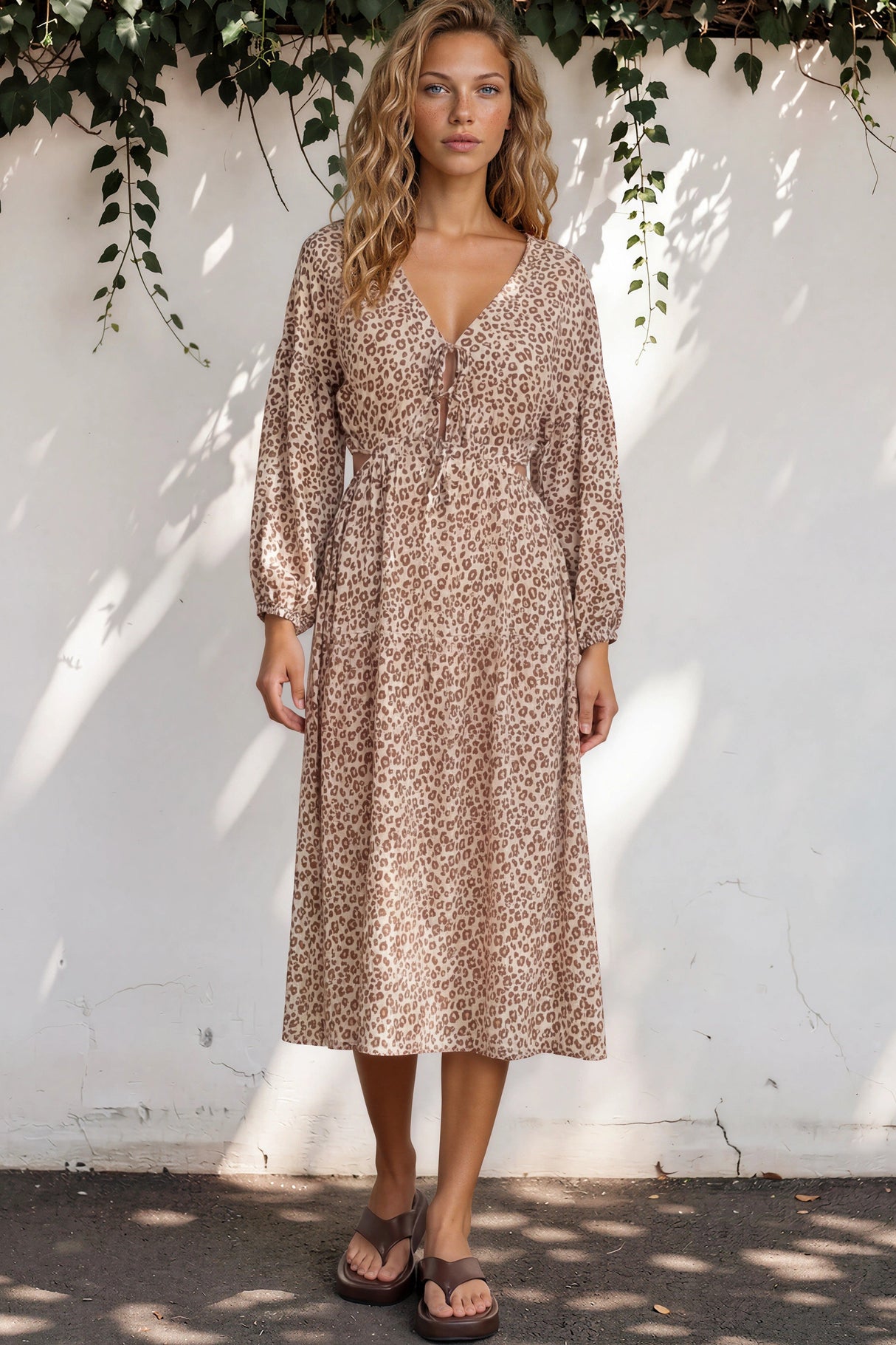 Model wearing Sona Midi Dress in Leo Lily Print from Salty Crush