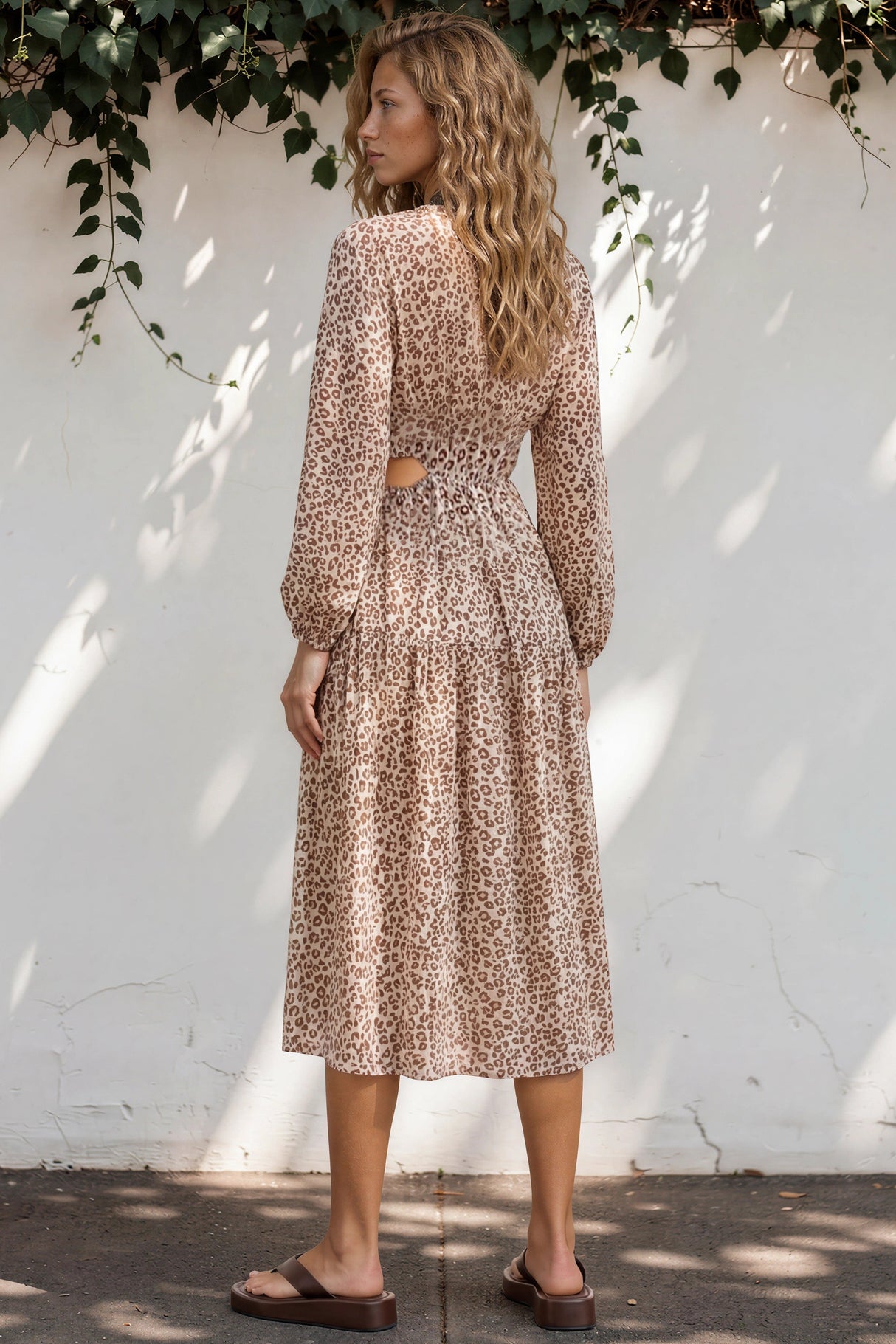 Model wearing Sona Midi Dress in Leo Lily Print from Salty Crush