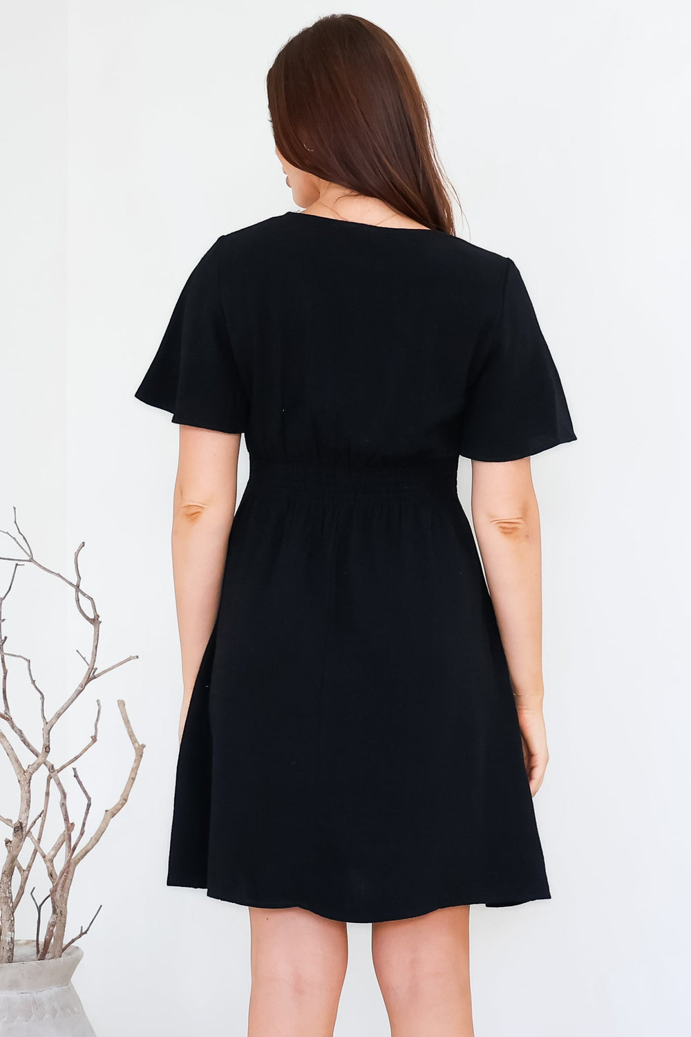 Stellar Mini Dress - Flutter Sleeve A-Line Dress with Pin Tuck Waist Detail in Black