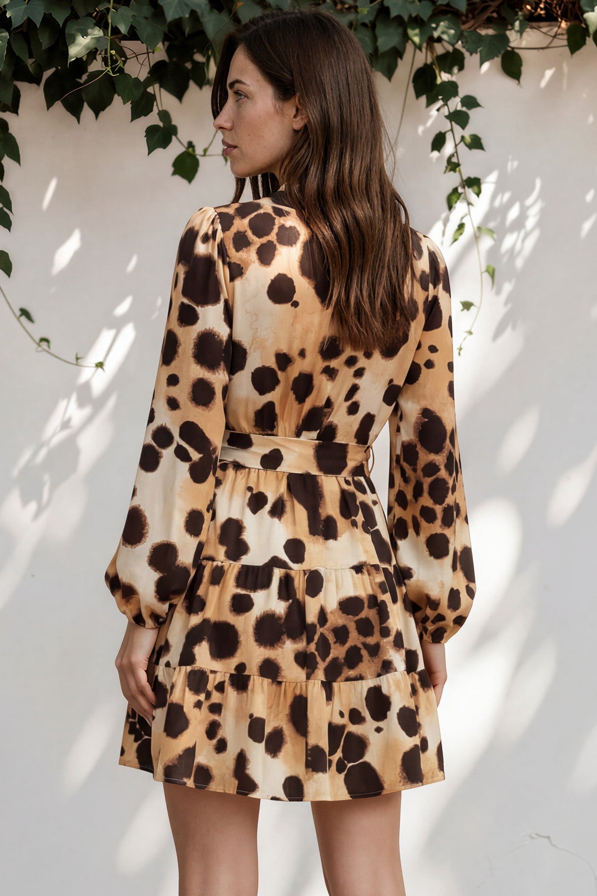 Model wearing Sybil Mini Dress in Leopard Print from Salty Crush