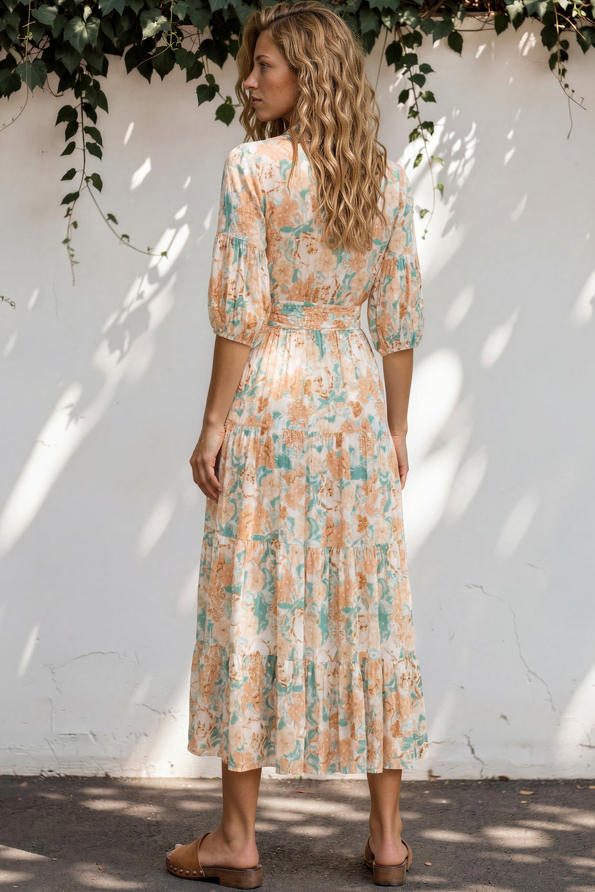 Model wearing Thianna Wrap Maxi Dress in Begonia Print from Salty Crush