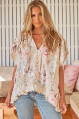 JAASE - Fisico Top: High V Neck Slouchy Blouse with Crochet Trim Hemline in Empire Print