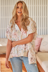 JAASE - Fisico Top: High V Neck Slouchy Blouse with Crochet Trim Hemline in Empire Print