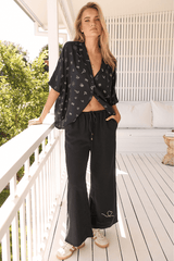 JAASE - Cici Pants: Mid Rise Relaxed Wide Leg Pant in Love Is All Round Print - Black