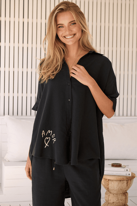 JAASE - River Shirt: Oversized Button Down Shirt with Scoop High-Low Hem in Love Is All Around Print- Black