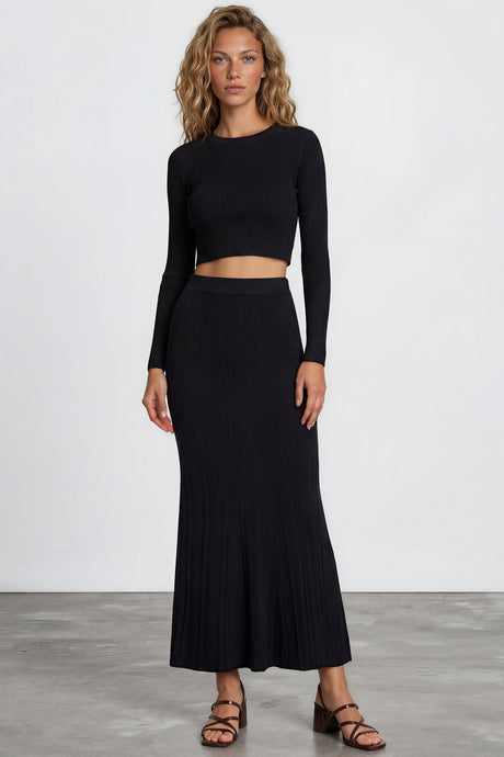 Model wearing Ada Maxi Skirt in Black from Salty Crush