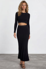 Model wearing Ada Maxi Skirt in Black from Salty Crush