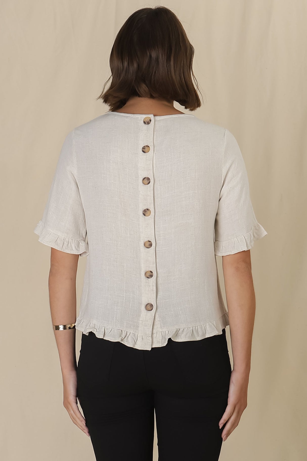 Adria Top - Frill High-Low Hem with Wooden Button Down Back Top in Oat