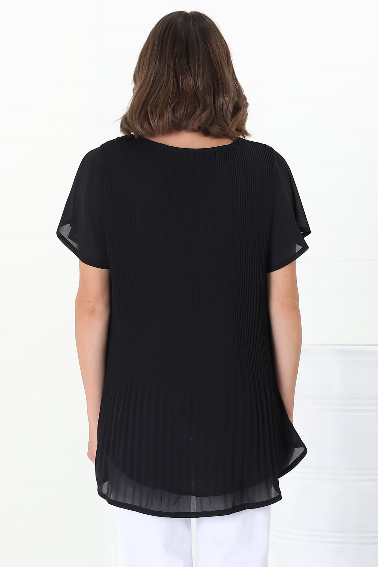 Alek Blouse - Plisse Cap Sleeve Top with High-Low Hemline in Black