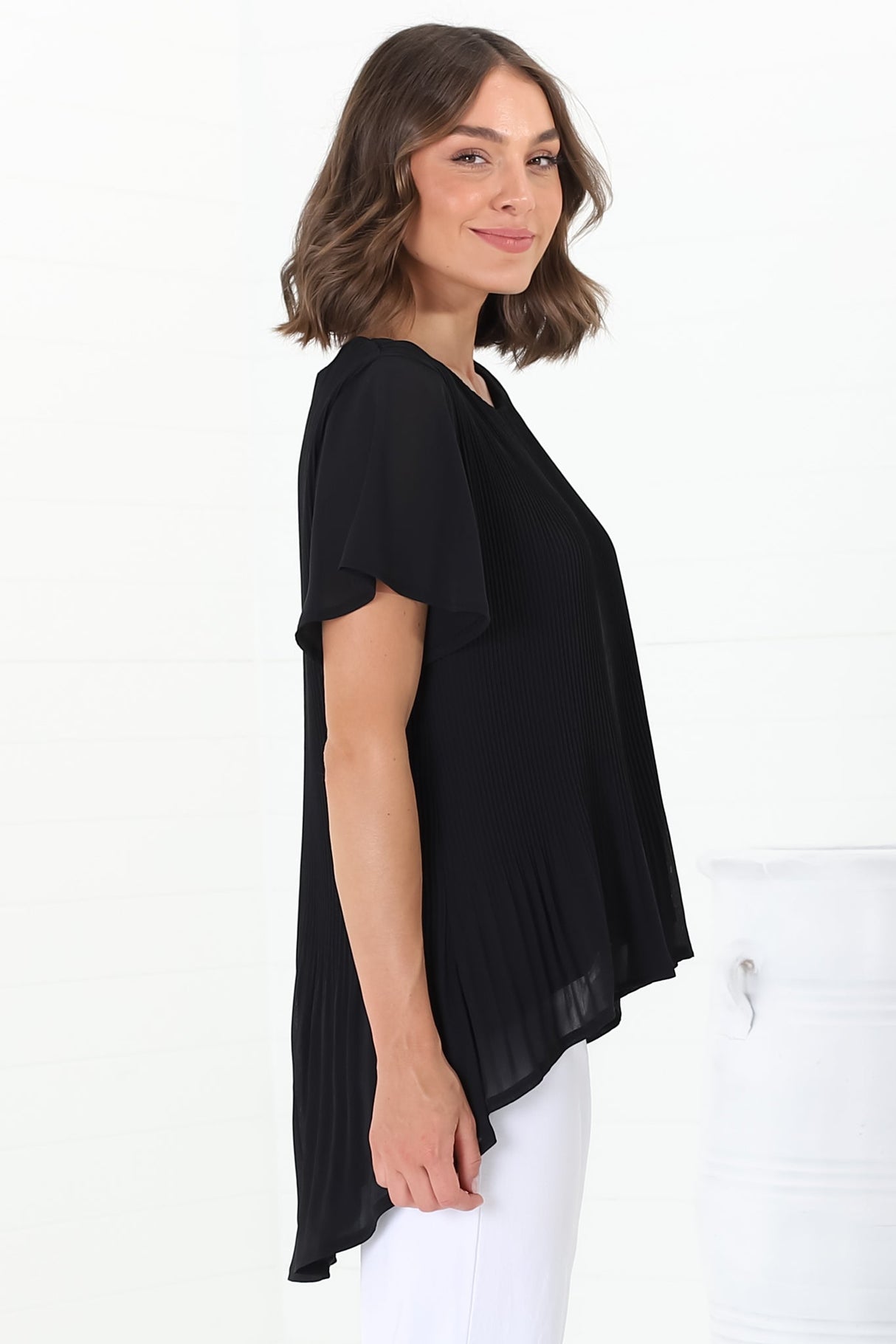 Alek Blouse - Plisse Cap Sleeve Top with High-Low Hemline in Black