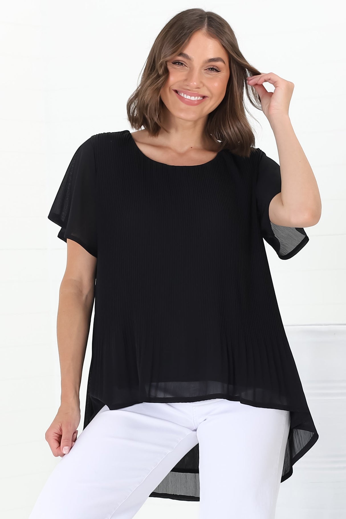 Alek Blouse - Plisse Cap Sleeve Top with High-Low Hemline in Black