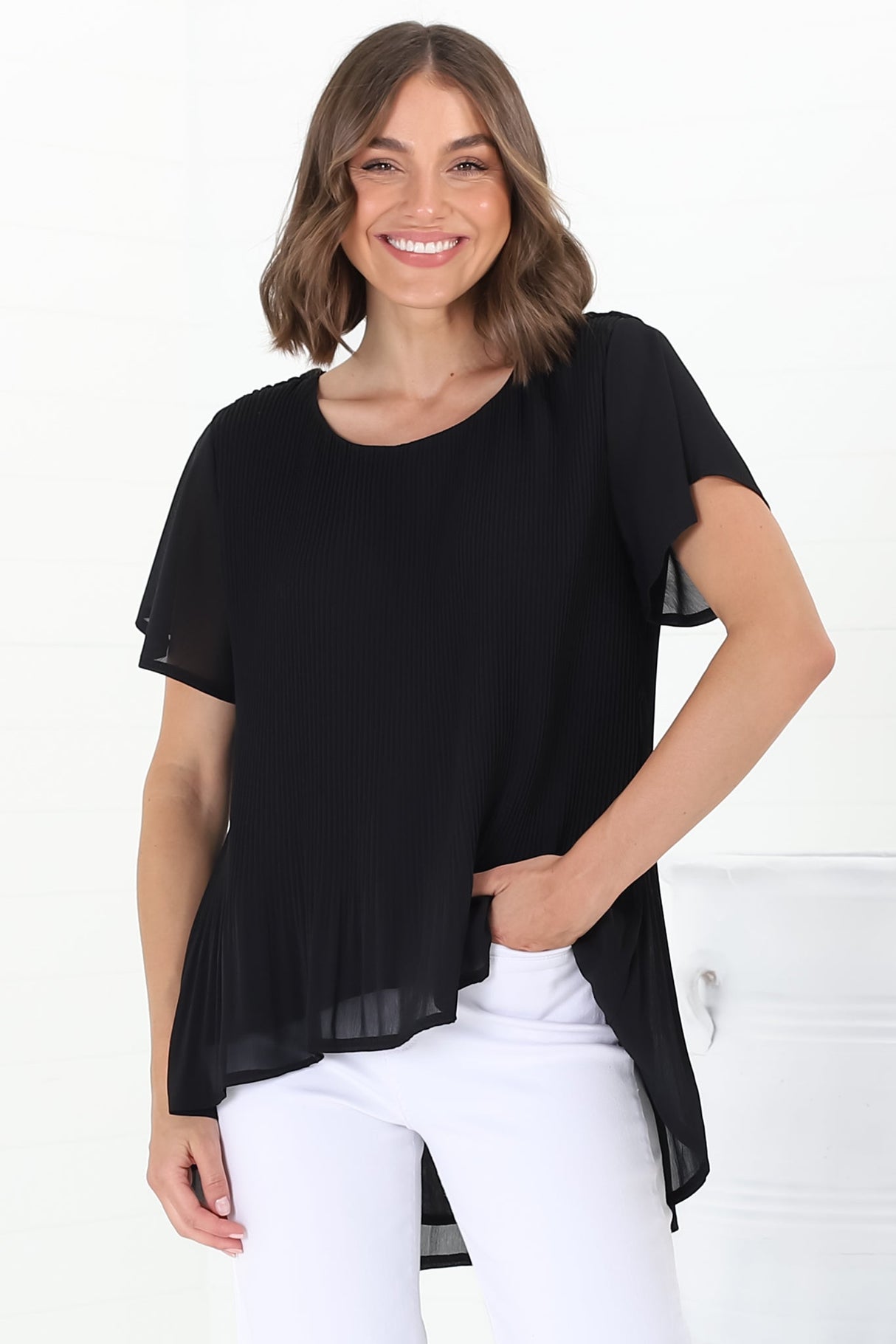 Alek Blouse - Plisse Cap Sleeve Top with High-Low Hemline in Black