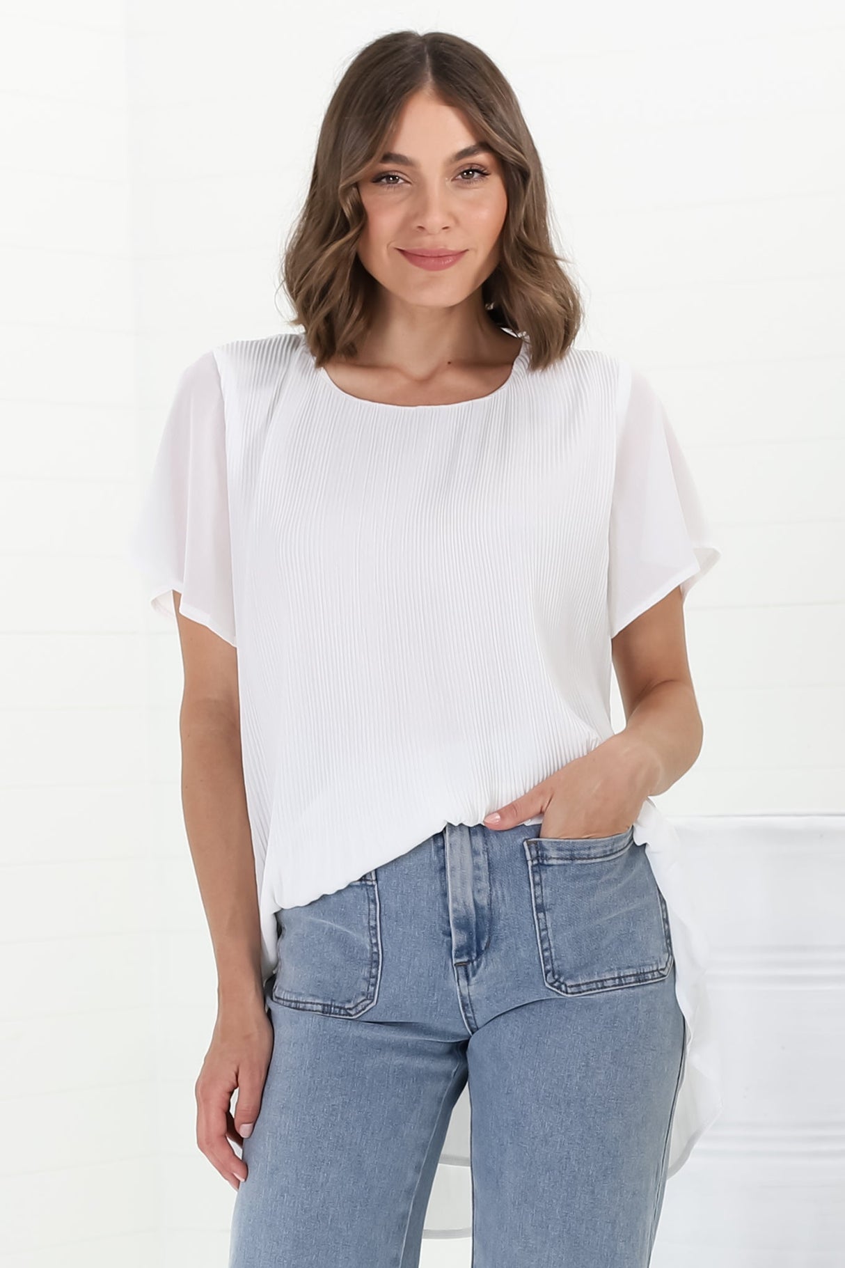 Alek Blouse - Plisse Cap Sleeve Top with High-Low Hemline in White