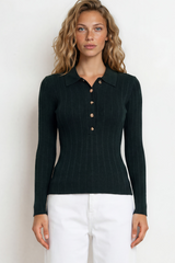 Woman wearing a black long-sleeve shirt with buttons and white pants on a white background