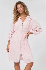 Model wearing Alyce Mini Dress in Pink from Salty Crush in a white background