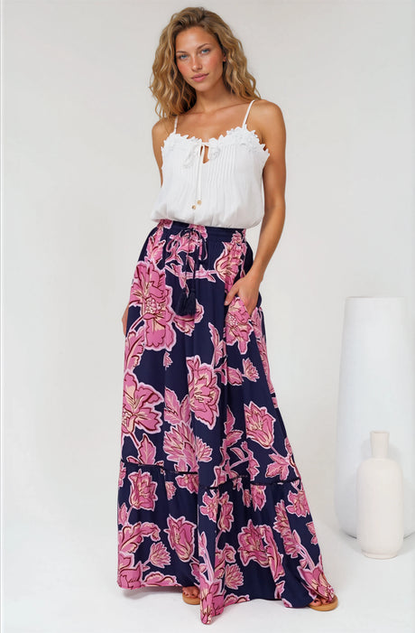 A woman smiling wearing Amana Maxi Skirt in Kaila Print Navy from Salty Crush