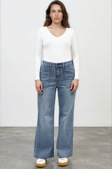 Model wearing Amonie Jeans in Mid Wash Denim from Salty Crush
