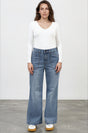 Model wearing Amonie Jeans in Mid Wash Denim from Salty Crush