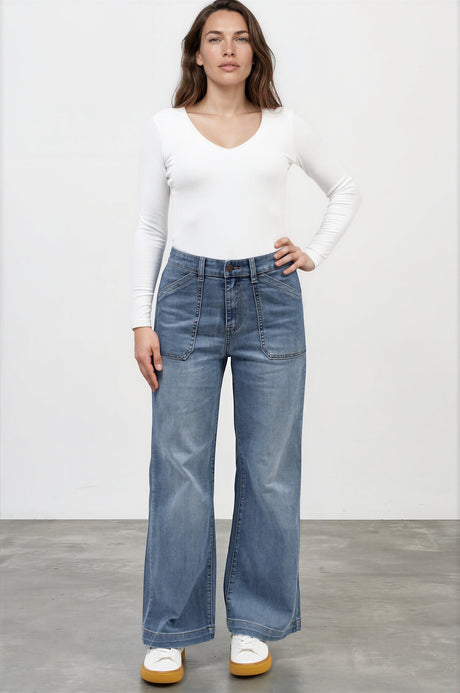 Model wearing Amonie Jeans in Mid Wash Denim from Salty Crush