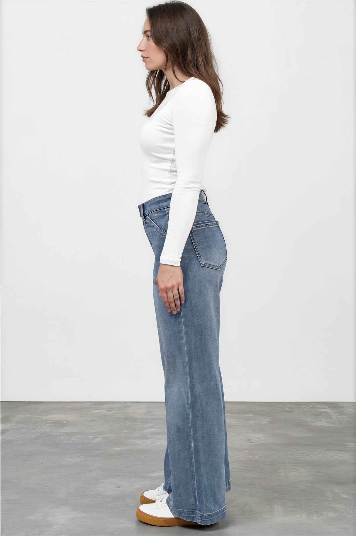 Model wearing Amonie Jeans in Mid Wash Denim from Salty Crus