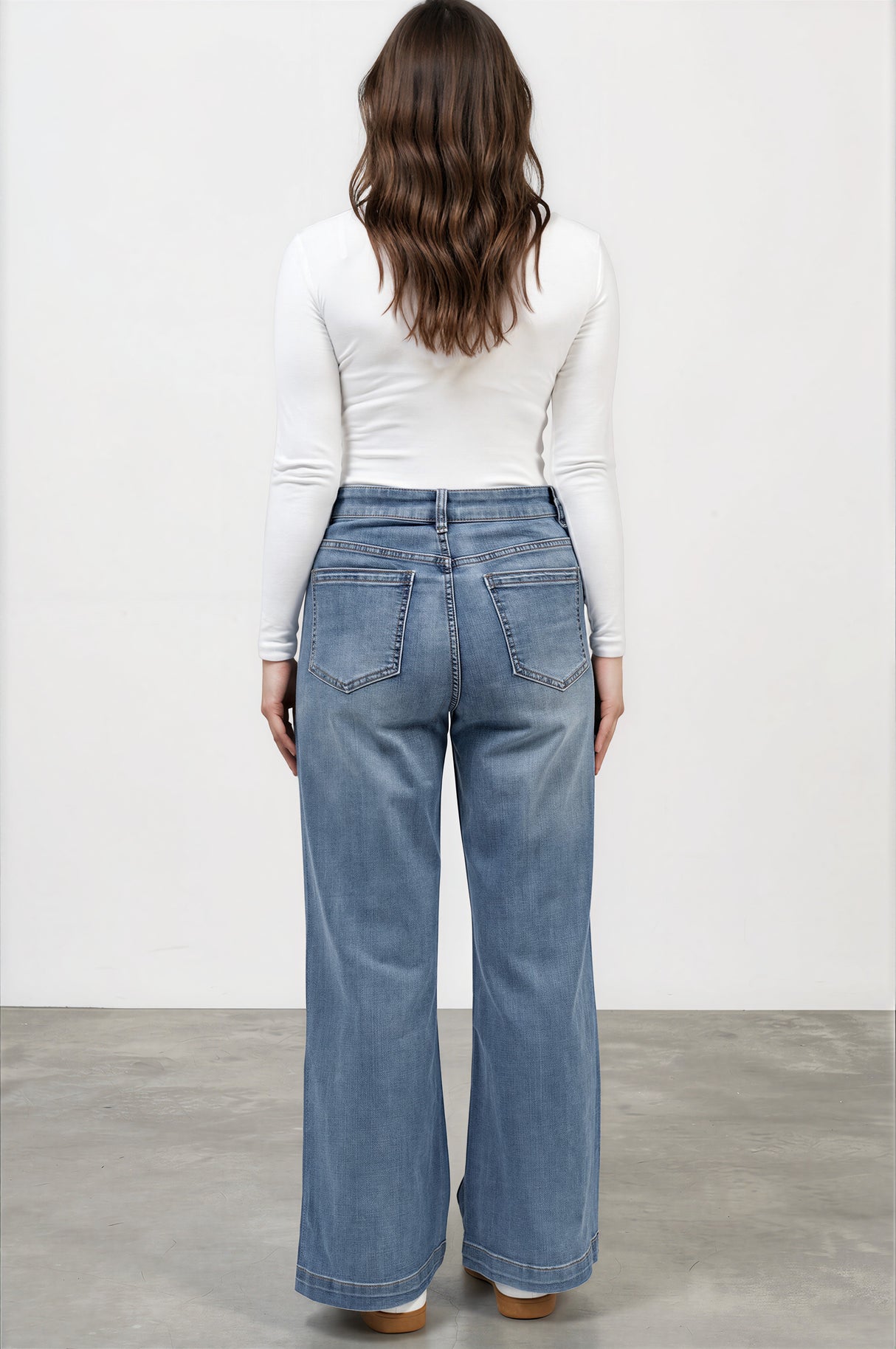 Model wearing Amonie Jeans in Mid Wash Denim from Salty Crush