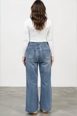 Model wearing Amonie Jeans in Mid Wash Denim from Salty Crush