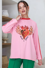 Model wearing Amor E Sorte Long Sleeve Tee in Pink from Salty Crush