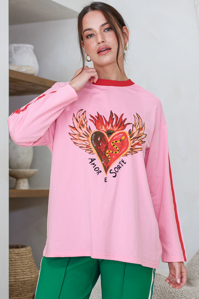 Model wearing Amor E Sorte Long Sleeve Tee in Pink from Salty Crush