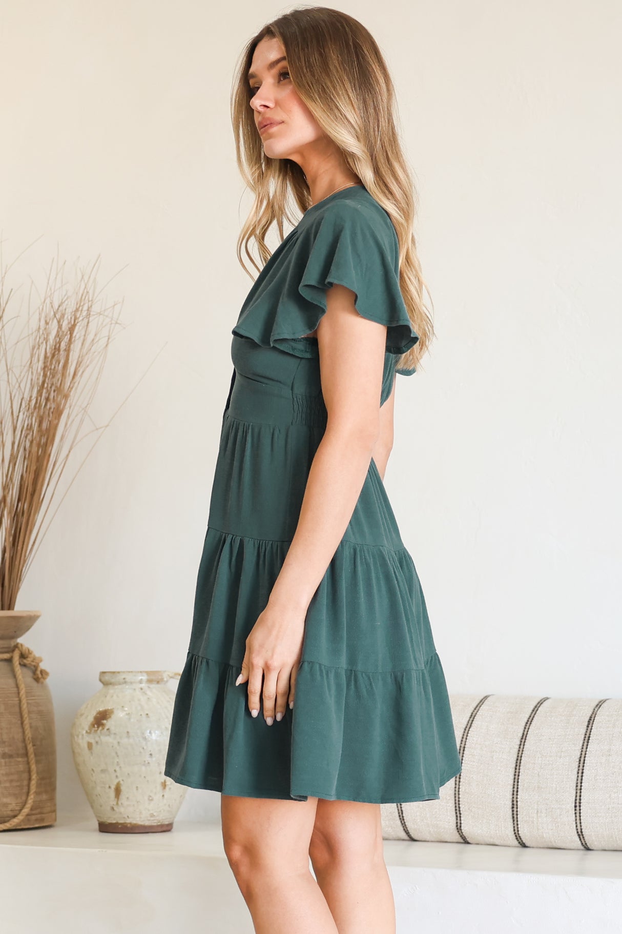 Model wearing Amy Mini Dress in Emerald from Salty Crush