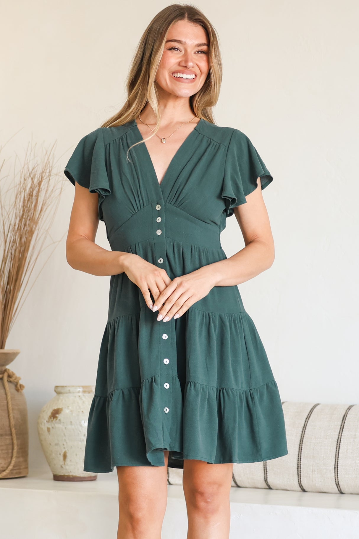 Model wearing Amy Mini Dress in Emerald from Salty Crush
