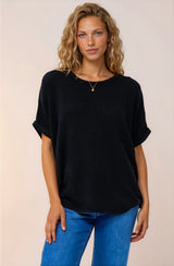 A model smiling wearing Andre Top n Black from Salty Crush