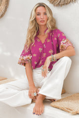 Arden Blouse: V-Neck Buttoned Through Scoop Hem Top in Bee Orchid Print