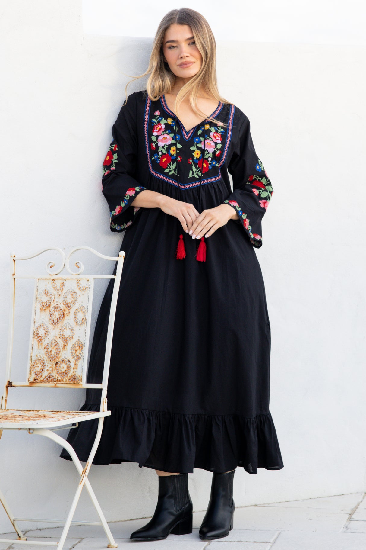 Model wearing Azalea Midi Dress in Black from Salty Crush