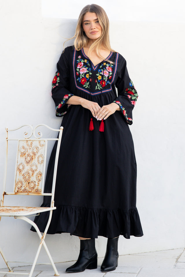 Model wearing Azalea Midi Dress in Black from Salty Crush