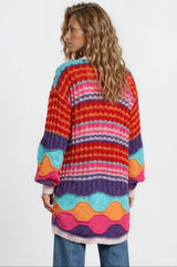 Model wearing Bellatrix Cardigan in Pink from Salty Crush