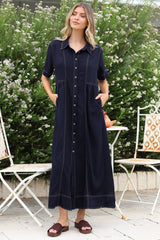 Model wearing Bento Midi Dress in Indigo from Salty Crush