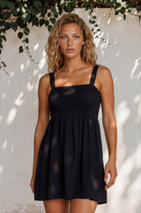 Model wearing Bliss Mini Dress in Black from Salty Crush
