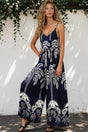 Model wearing Brittany Jumpsuit in Kora Print Navy from Salty Crush