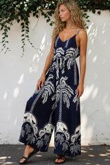 Model wearing Brittany Jumpsuit in Kora Print Navy from Salty Crush
