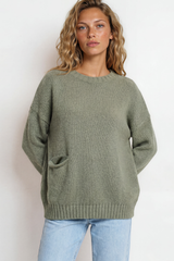 Model wearing Caesar Jumper in Green from Salty Crush