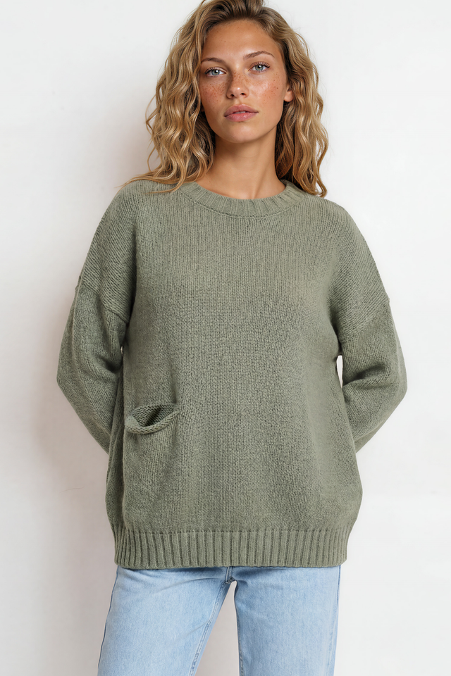 Model wearing Caesar Jumper in Green from Salty Crush