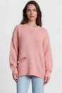 Model wearing Caesar Jumper in Pink from Salty Crush
