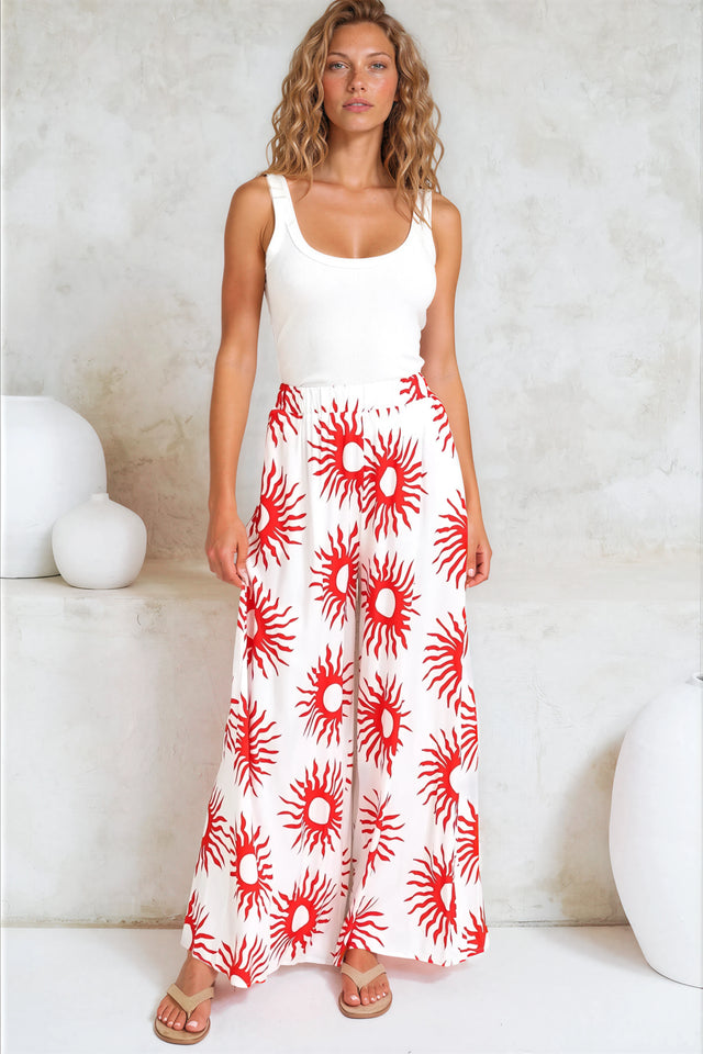 Model wearing Channing Pants in Solar Print Red from Salty Crush