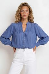 Model wearing Cindie Blouse in Blue from Salty Crush
